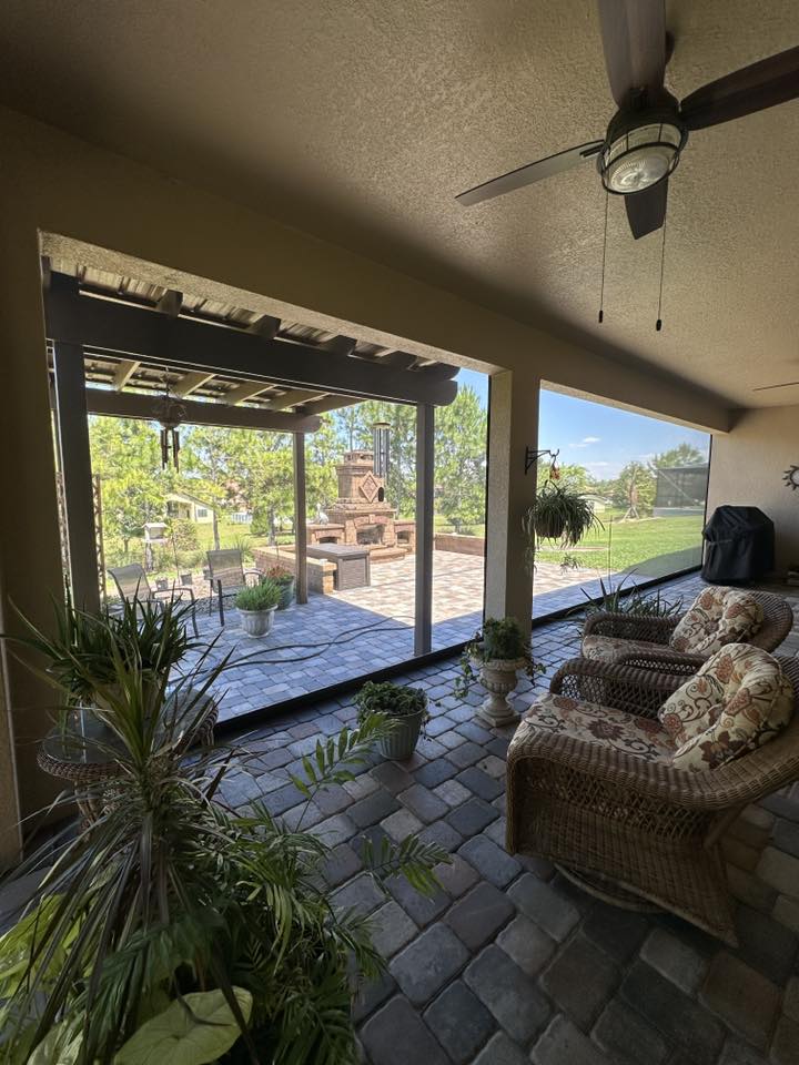 Screened patio space with outdoor furniture